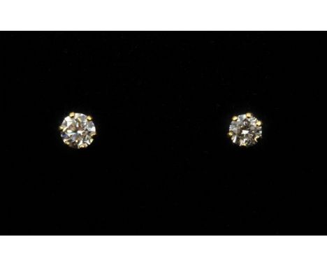 A pair of 18ct yellow gold diamond set stud earrings, (one butterfly replaced).