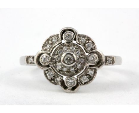 A white gold (stamped 9K) cubic zirconia set cluster ring, (P.5).