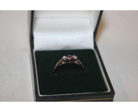 A yellow metal ruby and diamond set ring 