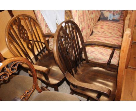 A pair of stick and wheel back carver chairs