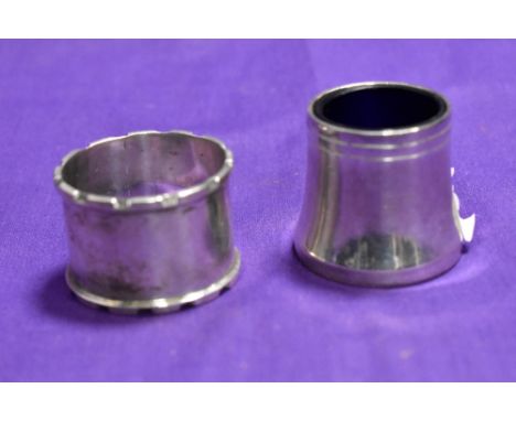 A John Rose of Birmingham silver napkin ring with engraved initials and a white metal salt with blue glass liner