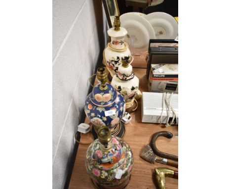 Four table lamp bases, to include two Masons and two with oriental styling.