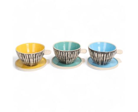 ERIC LEAPER, Newlyn, Cornwall, a set of 3 studio ceramic tea bowls and saucers with pinched handles, all signed to base, sauc