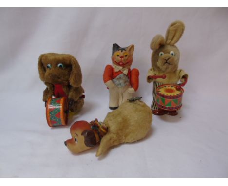 4 various vintage clockwork toys