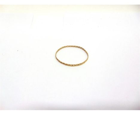A 9 CARAT GOLD BANGLE of plaited design, 3mm wide, 6.4cm internal diameter, 7.3g gross