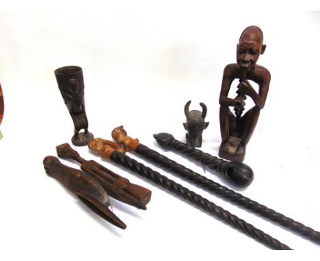 A GROUP OF AFRICAN TRIBAL CARVED WOODEN OBJECTS, comprising a figural cup modelled as a woman carrying a basket on her back, 