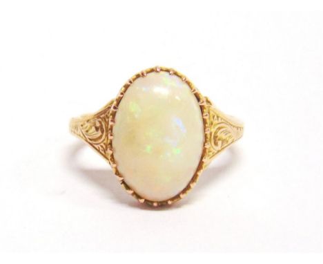 A SINGLE STONE OPAL RING stamped '15', claw set between engraved shoulders, finger size H, 2g gross