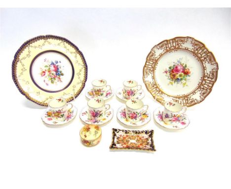 A COLLECTION OF ROYAL CROWN DERBY to include two cabinet plates, each with painted floral centres within gilt borders, signed