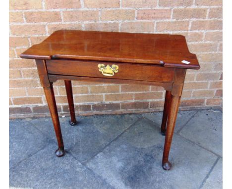 A MAHOGANY SIDE TABLE with associated shaped top, on pad feet, 81cm wide 40cm deep 72.5cm high