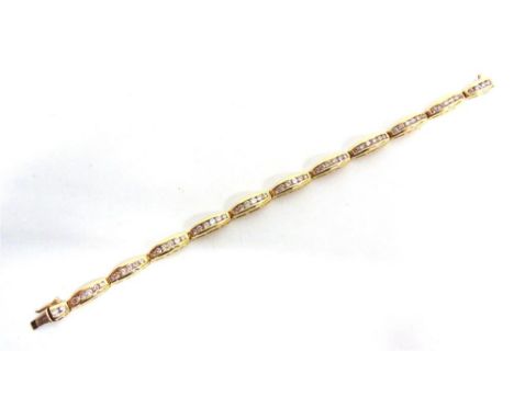 A DIAMOND LINE BRACELET the sixty six brilliant cuts totalling approximately 4 carats estimated, channel set in groups of six