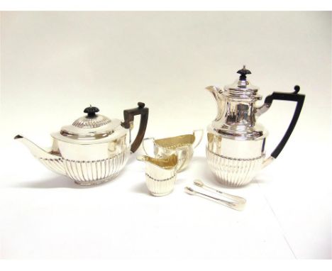 A MATCHED FOUR PIECE TEA SERVICE the oval gadrooned teapot by Messrs Barnard, London 1900, the cream jug and sugar basin, by 