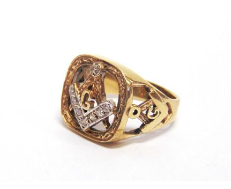 9 CARAT GOLD MASONIC RING set with cubic zirconias to the open work set square and compass, finger size T, 8g gross