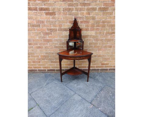 AN EDWARDIAN ROSEWOOD CORNER TABLE with line, urn and bellflower inlay with mirrored corner shelf over, and raised on three s