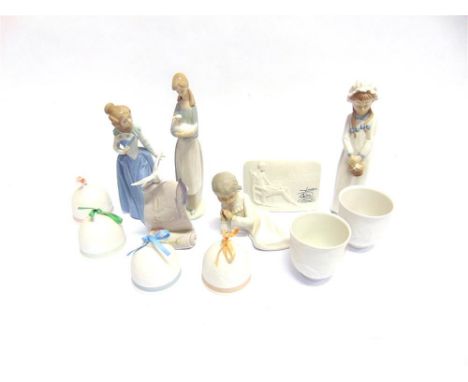 A COLLECTION OF LLADRO AND NAO including two Lladro Collectors Society cups decorated with dolphins and sailing boats, four L