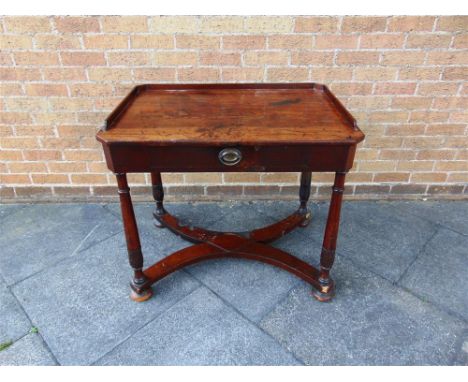 A 19TH CENTURY MAHOGANY SIDE TABLE the rectangular top with canted corners and fitted with gallery and single drawer, on turn