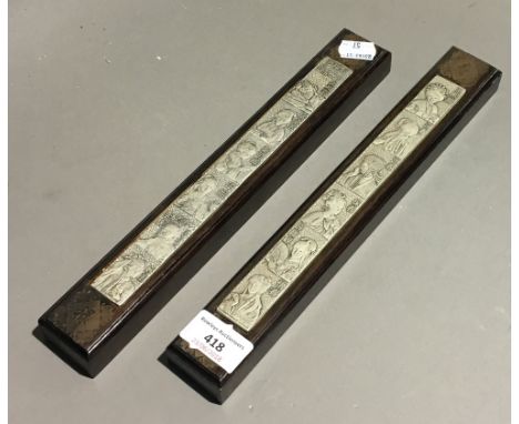 A pair of Chinese scroll weights