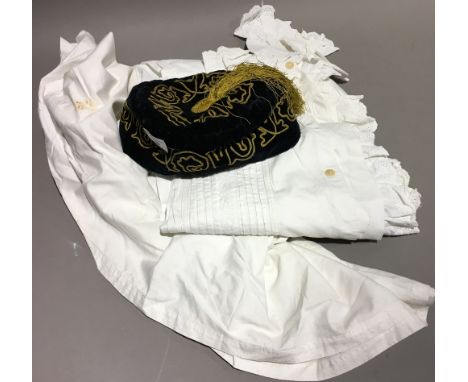 A lace nightgown, together with an embroidered skull/smoking cap