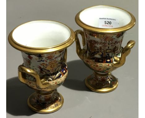 A pair of Spode porcelain campana form two handled vases, circa 1805-1810, with pattern number 967