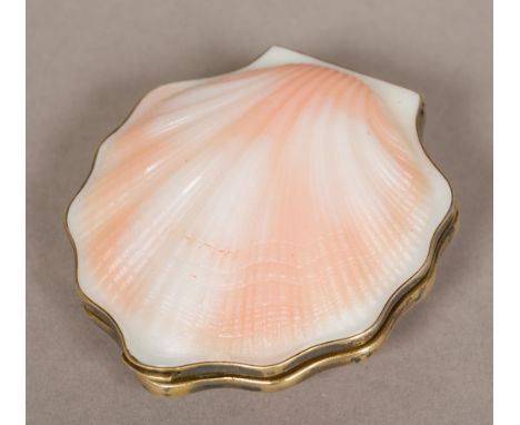 A Russian silver gilt mounted compactOf small clam shell form.  7 cm wide. 