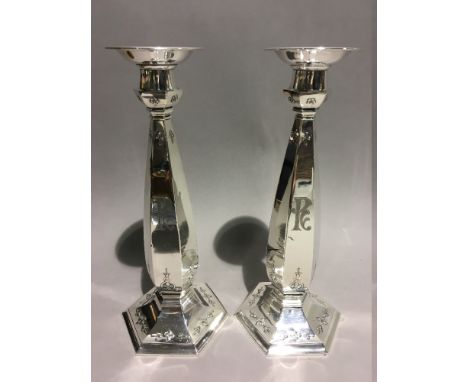 An unusual pair of sterling silver Art Deco candlesticks, American, dated 1921 under base