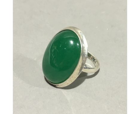 A silver and jade ring