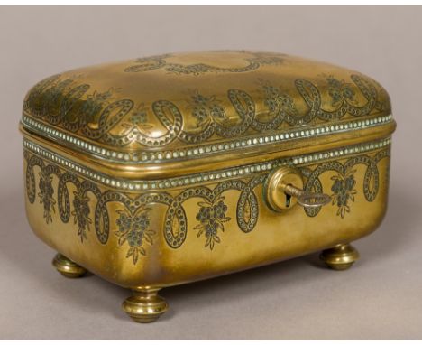 A 19th century engraved brass trinket boxOf hinged domed rectangular form, decorated with fruiting scrollwork, standing on tu