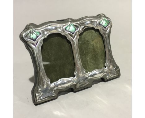 A double silver and enamel Art Nouveau style frame