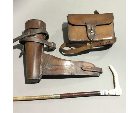 A leather cased silver plated sandwich box, a leather cased stirrup flask and a riding crop