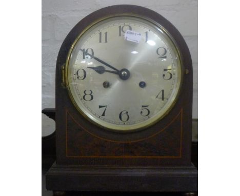 A Victorian inlaid mantle clock