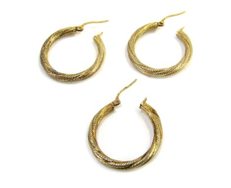 Three 9ct gold bi-colour hoop earrings, 2.5cm wide, 2.6g.