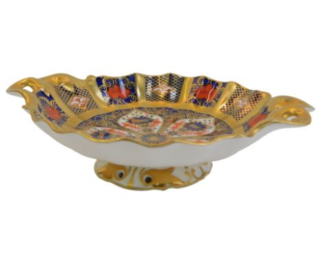 A Royal Crown Derby Old Imari porcelain twin handled pedestal sweetmeat dish, gold ground, pattern 1128, red printed marks, 1