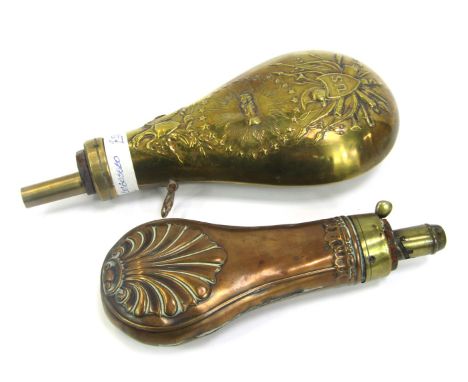 An American brass powder flask, embossed with shield stating US, two hands clasped and an eagle amongst star motifs, 22cm hig