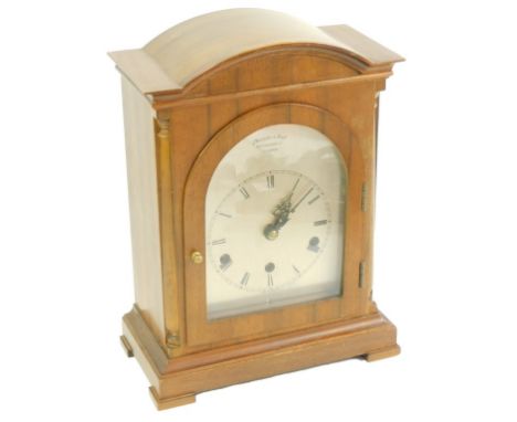 A Thwaites and Reeds of Clerkenwell mahogany cased mantel clock, the silvered arched dial with chapter ring bearing Roman num