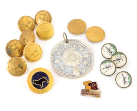 A Queen Victoria and Empire India commemorative medal, three enamel dog buttons, military stag buttons, etc. 