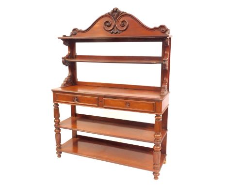 A 19thC Continental mahogany buffet, the top with a raised scroll carved back above two shelves, the base with frieze drawers