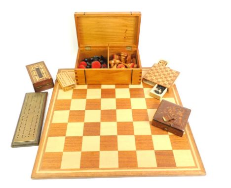 A 20thC chess board, together with a treen box containing various chess pieces, the board 50cm x 50cm, together with various 