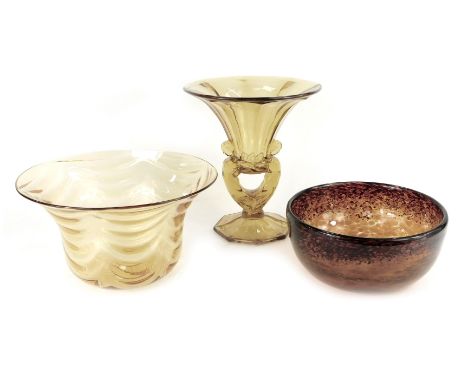 A group of amber tinted glassware, comprising bowl of tapering form, 26.5cm diameter, pedestal dish, the stem moulded with tw