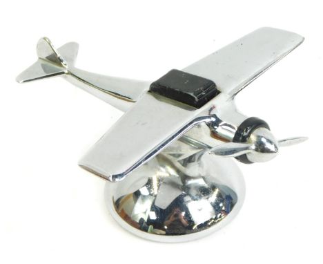 A 1950s American novelty chrome table lighter, modelled as a single propeller aeroplane, 7.5cm high. 