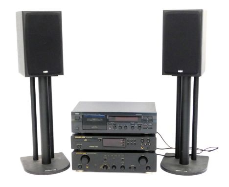 A stereo system, comprising Yamaha stereo cassette deck KX-393, a Marantz CD player CD5000 and integrated amplifier PM4200, t