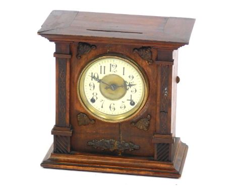 A late 19thC Continental oak cased mantel clock, circular brass dial with enamel chapter ring bearing Arabic numerals, eight 