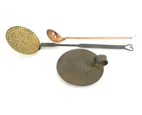 A group of 18thC and 19thC cooking implements, comprising 19thC tin plate skillet, 19thC wrought iron with brass skimmer, 60c