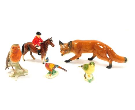 A group of pottery figures, comprising a Beswick greenfinch 2105, pheasant, a Goebel matt porcelain robin, a Beswick style po