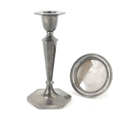 Two items of silverware, comprising an Elizabeth II taper candlestick, Sheffield 1955, with weighted base, 7oz gross, and a G