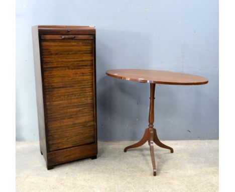 An early 20th century mahogany oval topped occasional table on tripod base, a filing cabinet and another cabinet. (3).   