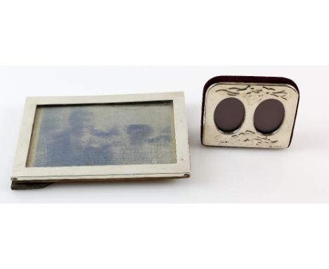 Two silver-mounted photograph frames, one a double portrait frame, the larger 11 x 16 cm (2).   