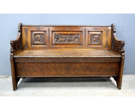 Early 20th century carved oak bench .   