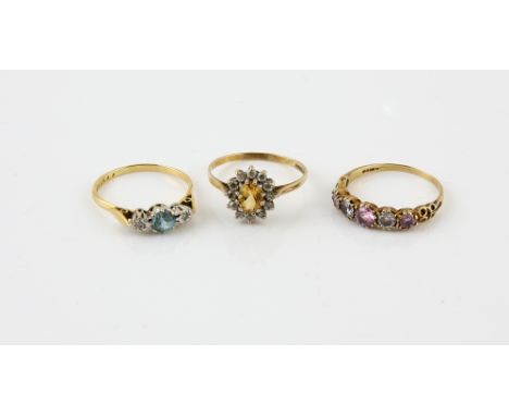 Three gold rings, vintage blue zircon and diamond three stone, in 18 ct hallmarked Birmingham 1971, size R, citrine and cubic