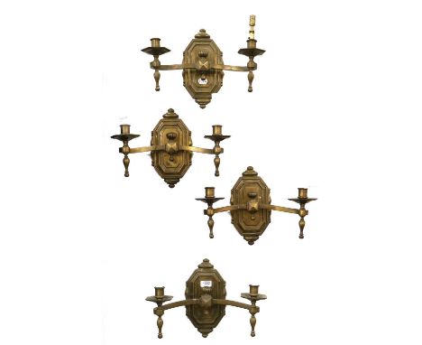 A Set of Four Patinated Metal Twin-Light Wall Sconces