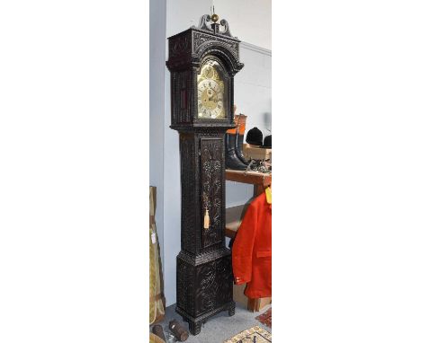 A Carved Oak Eight-Day Longcase Clock, 12" arch brass dial with chapter ring inscribed George Wasse, Fecit, later case, 236cm