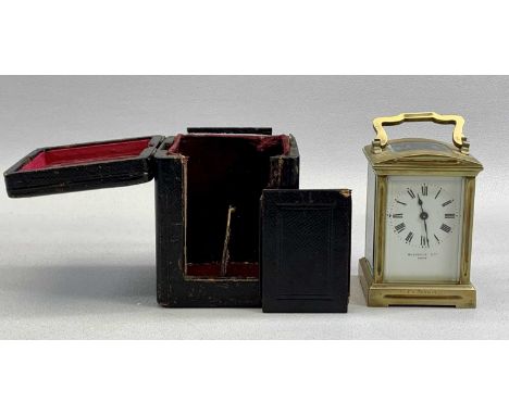 RUSSELL'S LTD, PARIS GILT BRASS CASED CARRIAGE CLOCK, white enamel dial with Roman numerals, signed, 8-day movement, in leath